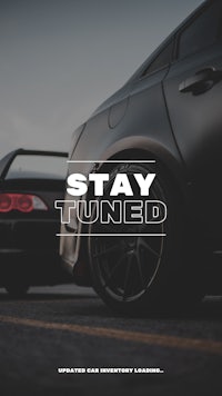 a black and white photo of a car with the words stay tuned